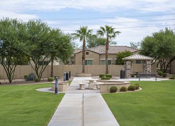 Courtyard with benches and a gazebo in grassy area
